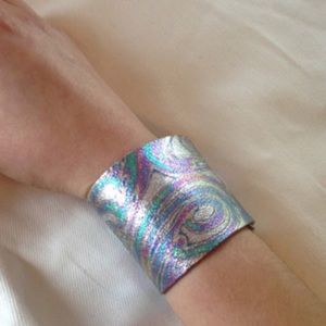 Psychedelic  leather oil slick snap cuffs LARGE